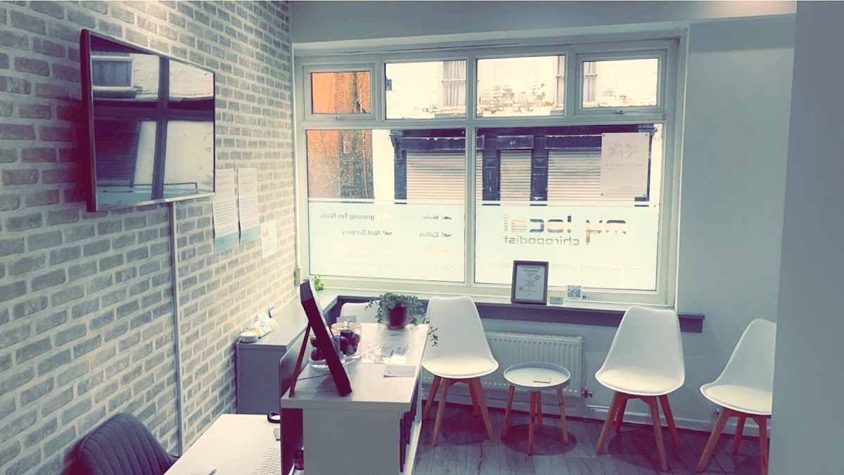 The reception desk and waiting chairs by the window